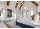 Beautiful bedroom with a gray rug, light walls and ceiling with wooden beams at 833 Dunleigh Dr, Burlington, NC 27215
