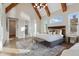 Bright main bedroom featuring high vaulted ceilings, wood beams, and natural light at 833 Dunleigh Dr, Burlington, NC 27215