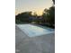 Relaxing backyard pool with views of the lake and houses during sunset at 833 Dunleigh Dr, Burlington, NC 27215