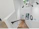 Bright staircase featuring custom millwork and modern light fixture at 833 Dunleigh Dr, Burlington, NC 27215