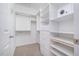 Walk-in closet with shelves and safe at 8437 Whisper Ridge Pl, Raleigh, NC 27613