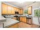 Well-equipped kitchen featuring wood cabinets and stainless steel appliances at 8437 Whisper Ridge Pl, Raleigh, NC 27613