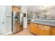 Modern kitchen featuring stainless steel appliances and a breakfast bar at 8437 Whisper Ridge Pl, Raleigh, NC 27613