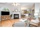 Inviting living area with a fireplace and open layout to the kitchen at 8437 Whisper Ridge Pl, Raleigh, NC 27613