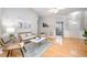 Elegant living room with hardwood floors and stylish seating at 8437 Whisper Ridge Pl, Raleigh, NC 27613