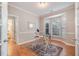 Office with desk, chair, mirror, and built-in desk at 8437 Whisper Ridge Pl, Raleigh, NC 27613