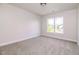 Bright bedroom features plush carpet and a view of the yard at 95 Lockhaven Ct, Cameron, NC 28326
