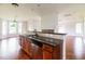 Kitchen view shows island with sink and dishwasher, and view into dining room and living space at 95 Lockhaven Ct, Cameron, NC 28326