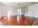 Open living space with hardwood floors, neutral walls, staircase, and natural light at 95 Lockhaven Ct, Cameron, NC 28326