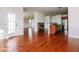 Open layout living space shows door to outside, fireplace, island with sink, and stainless appliances at 95 Lockhaven Ct, Cameron, NC 28326