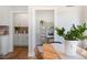 Open-concept dining area leads to a study and kitchen, featuring modern decor and ample natural light at 1038 Beacon Hill Rd # 46, Lillington, NC 27546