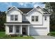 Charming two-story home featuring white siding, a covered porch, and an attached two-car garage at 1038 Beacon Hill Rd # 46, Lillington, NC 27546