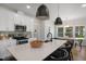 Modern kitchen with white cabinets, stainless steel appliances, and island seating at 1038 Beacon Hill Rd # 46, Lillington, NC 27546