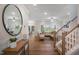 Spacious living room with hardwood floors, large windows, and a view of the dining room at 1038 Beacon Hill Rd # 46, Lillington, NC 27546