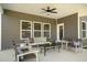 Inviting covered patio with ample seating and a ceiling fan for outdoor relaxation at 1038 Beacon Hill Rd # 46, Lillington, NC 27546