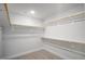 Organized walk-in closet with ample shelving and rods, perfect for maximizing storage and keeping items accessible at 1038 Beacon Hill Rd # 46, Lillington, NC 27546