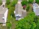 Aerial view of a well-maintained property, including a gazebo, lawn, and mature trees at 104 Harvolly Dr, Holly Springs, NC 27540