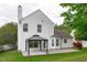 Backyard featuring a covered patio and a well-manicured lawn, offering a perfect outdoor space at 104 Harvolly Dr, Holly Springs, NC 27540
