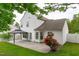 Well-maintained backyard features a gazebo and a beautiful rose bush near the house at 104 Harvolly Dr, Holly Springs, NC 27540