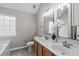 This bright bathroom features double sinks and vanity at 104 Harvolly Dr, Holly Springs, NC 27540