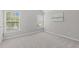 This cozy bedroom has a window and neutral paint at 104 Harvolly Dr, Holly Springs, NC 27540