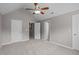 This large bedroom boasts neutral colors and multiple doors at 104 Harvolly Dr, Holly Springs, NC 27540
