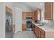Well-equipped kitchen boasts stainless steel appliances, light countertops, and ample cabinetry for storage at 104 Harvolly Dr, Holly Springs, NC 27540