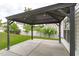 Covered outdoor patio features a concrete flooring and an outdoor entertaining space with lovely yard at 104 Harvolly Dr, Holly Springs, NC 27540