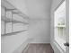 This walk-in closet features shelving and a window at 104 Harvolly Dr, Holly Springs, NC 27540