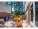 Back deck with outdoor seating, perfect for enjoying a peaceful outdoor setting at 104 Old Cooper Sq # Bldg J 3, Chapel Hill, NC 27517