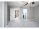 Spacious bedroom with carpet, leading to bathroom with glass shower, and views of the upstairs hallway at 104 Old Cooper Sq # Bldg J 3, Chapel Hill, NC 27517