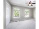 Spacious bedroom featuring two windows with natural light and a ceiling fan at 104 Old Cooper Sq # Bldg J 3, Chapel Hill, NC 27517