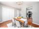 Dining room featuring a decorative chandelier with a view into the adjacent stainless steel kitchen at 104 Old Cooper Sq # Bldg J 3, Chapel Hill, NC 27517