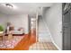 Inviting entryway showcases hardwood floors, staircase, and view into living room at 104 Old Cooper Sq # Bldg J 3, Chapel Hill, NC 27517