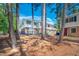View of townhouse complex featuring a mix of siding and brick exteriors and natural landscape at 104 Old Cooper Sq # Bldg J 3, Chapel Hill, NC 27517