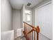 Upstairs hallway showcasing wooden railings and carpet, leading to the bedrooms and closet space at 104 Old Cooper Sq # Bldg J 3, Chapel Hill, NC 27517