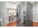 Bright kitchen with stainless steel refrigerator and dining area visible at 104 Old Cooper Sq # Bldg J 3, Chapel Hill, NC 27517