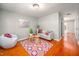 Cozy living room features hardwood floors, a decorative rug, and comfortable seating area at 104 Old Cooper Sq # Bldg J 3, Chapel Hill, NC 27517
