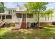 Backyard featuring a tree with a screened porch, patio and deck offering outdoor enjoyment at 104 Planetree Ln, Cary, NC 27511
