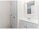 Bright bathroom features a white vanity with a framed mirror above the sink at 104 Planetree Ln, Cary, NC 27511