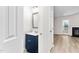 Bathroom featuring a blue vanity and tile flooring at 104 Planetree Ln, Cary, NC 27511