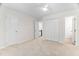 Bedroom with neutral carpet, white walls, closet and doorways at 104 Planetree Ln, Cary, NC 27511