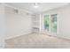 Bedroom with ceiling fan, built in shelving and large window with exterior view at 104 Planetree Ln, Cary, NC 27511