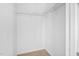 A walk-in closet features painted white walls, and a shelf and rod system for storage at 104 Planetree Ln, Cary, NC 27511