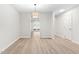 This dining room offers wood-look floors and natural light at 104 Planetree Ln, Cary, NC 27511