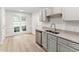 Kitchen featuring stainless steel appliances and countertops at 104 Planetree Ln, Cary, NC 27511