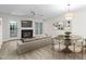 Inviting living room with fireplace, modern lighting, and stylish decor at 104 Planetree Ln, Cary, NC 27511