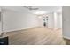 Bright living room features wood-look flooring and recessed lighting at 104 Planetree Ln, Cary, NC 27511