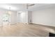 Spacious living room with wood flooring, ceiling fan and open floor plan at 104 Planetree Ln, Cary, NC 27511