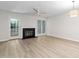 Bright and airy living room featuring a fireplace and natural light at 104 Planetree Ln, Cary, NC 27511